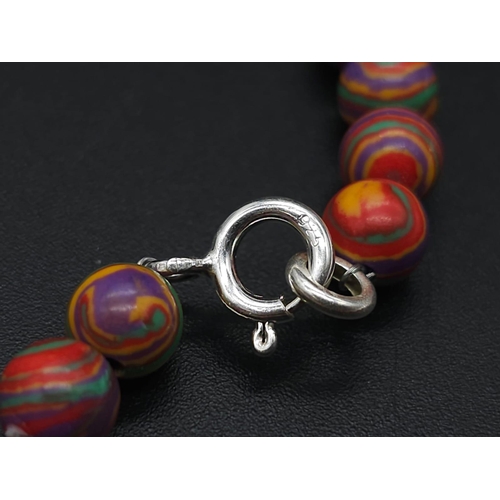 1998 - A trio of colourful 925 Silver Necklaces.
1) Blue beaded necklace, 925 clasp, amber stone pendant (5... 