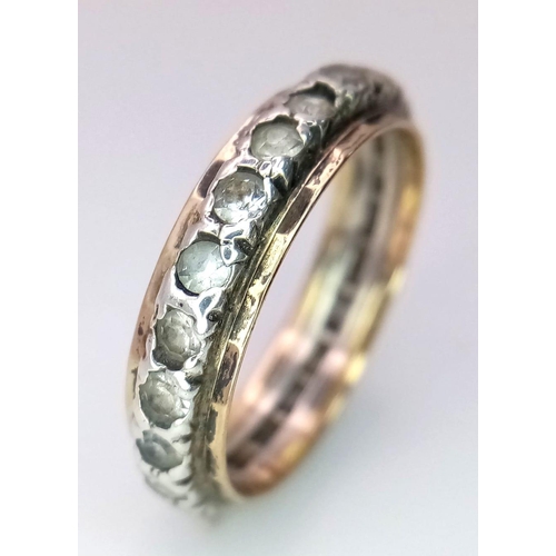 2890 - A 9K Gold and Silver White Stone Eternity Ring. Size J. 1.80g total weight.