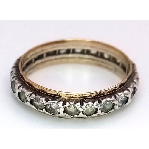 2890 - A 9K Gold and Silver White Stone Eternity Ring. Size J. 1.80g total weight.