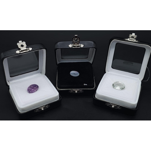 2891 - Three Certificated Gemstones: 9.59ct amethyst, 3.43ct Ethiopian opal and a 7.92ct light green prasio... 