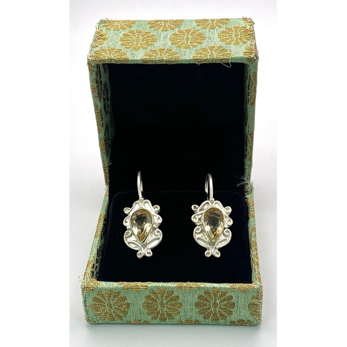 2898 - A Pair of Citrine, 925 Sterling Silver Drop Earrings. 9ctw. Drop - 2.5cm. Comes with a presentation ... 