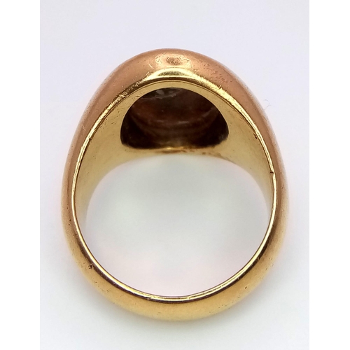 1150 - A Vintage 18K Yellow Gold Carnelian Signet Ring. A carved central stone of what appears to be an ima... 