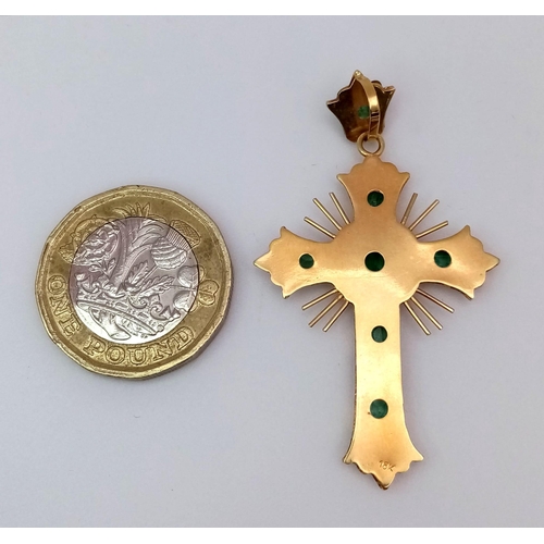 1280 - A Vintage 18K Yellow Gold and Emerald Cross. 1.2ctw of rich green emeralds decorate this holy symbol... 