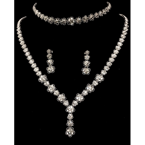 2899 - A Glorious 18K White Gold, Diamond Cut Necklace, Bracelet and Earring Set. Necklace - Graduated diam... 