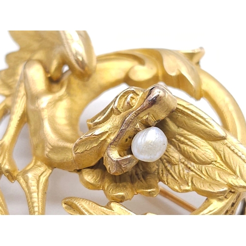 1268 - WITHDRAWN
An 18K Yellow Gold, Pearl and Diamond Brooch. The classic tale of the dragon and the pearl... 