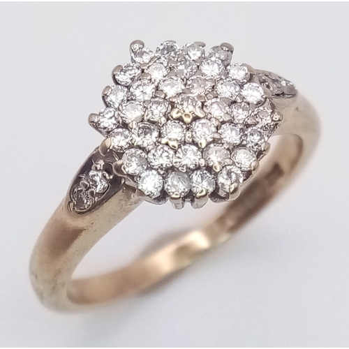 2900 - A Petite 9K Yellow Gold 0.25CT Diamond Encrusted Ring. Over 50 small round cut diamonds in a pave se... 