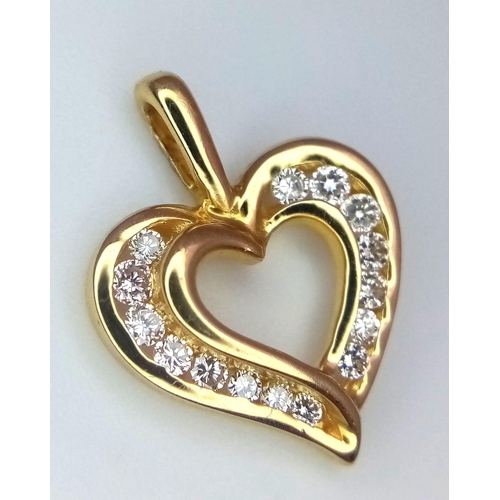 560 - A 18K YELLOW GOLD DIAMOND SEY HEART PENDANT 0.20CT 2.1G 12mm x 17mm
ref: 3168