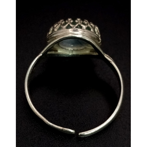 559 - A 925 silver Moonstone ring with adjustable band. Total weight 2.5G.