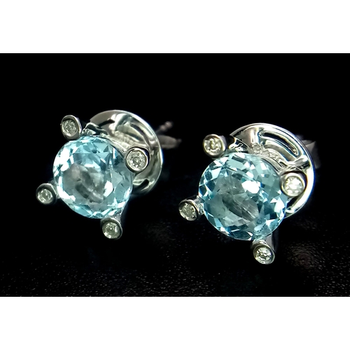 573 - A 18K WHITE GOLD DIAMOND & AQUAMARINE STUD EARRINGS, 2CT OF ROUND BRILIANT CUT AQUAMARINES 2.9G
ref:... 