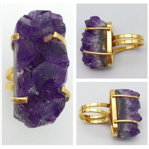 110 - A uniquely created, heavily gilded, bangle and ring set with a large natural bouquet of amethyst cry... 