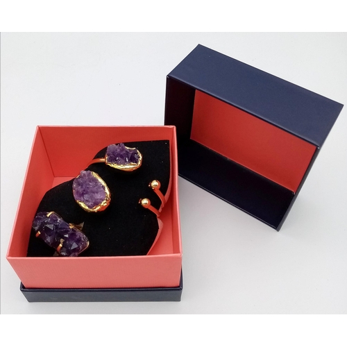 110 - A uniquely created, heavily gilded, bangle and ring set with a large natural bouquet of amethyst cry... 