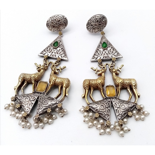 1140 - A Pair of Elaborate Gilded Reindeer Drop Earrings. Set amongst green and white stones on 925 silver.... 