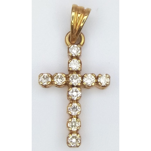 116 - A 14K YELLOW GOLD DIAMOND SET CROSS 0.33CT 1.3G 2.5cm x 1cm

(7991)