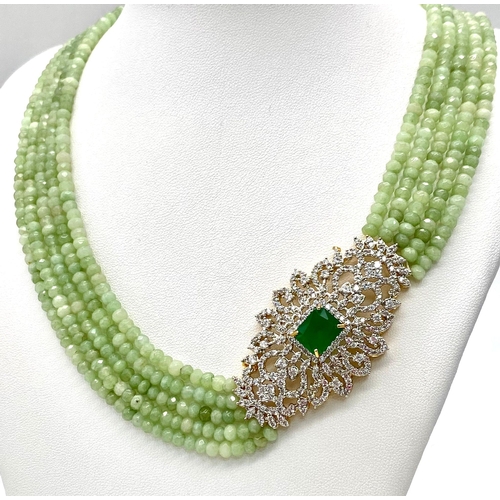 12 - A very elegant and sophisticated five row necklace with jade and emeralds accompanied by a pair of m... 