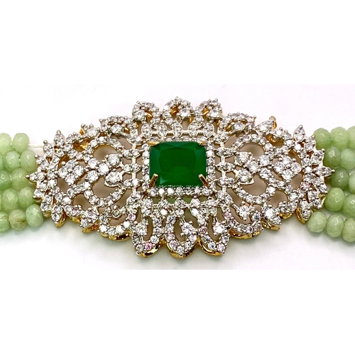 12 - A very elegant and sophisticated five row necklace with jade and emeralds accompanied by a pair of m... 