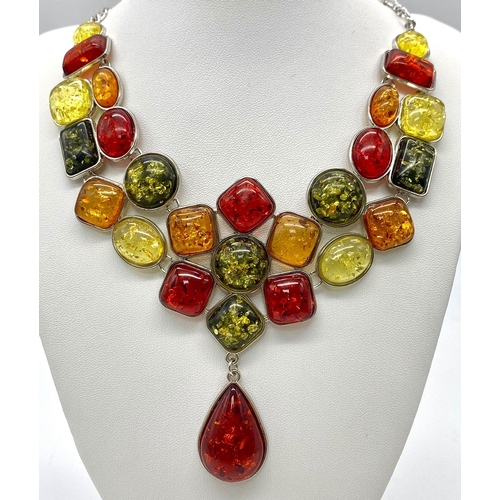 145 - A substantial, multi-coloured amber necklace, in a presentation case.