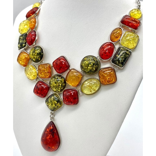 145 - A substantial, multi-coloured amber necklace, in a presentation case.