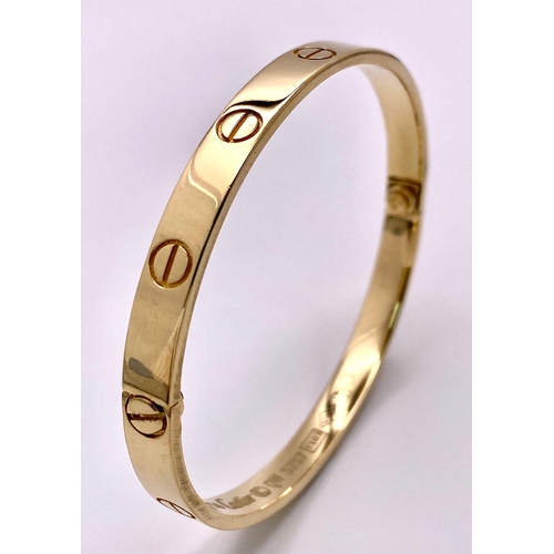 A 18K YELLOW GOLD CARTIER STYLE BANGLE 35.8G 20.2cm 7995