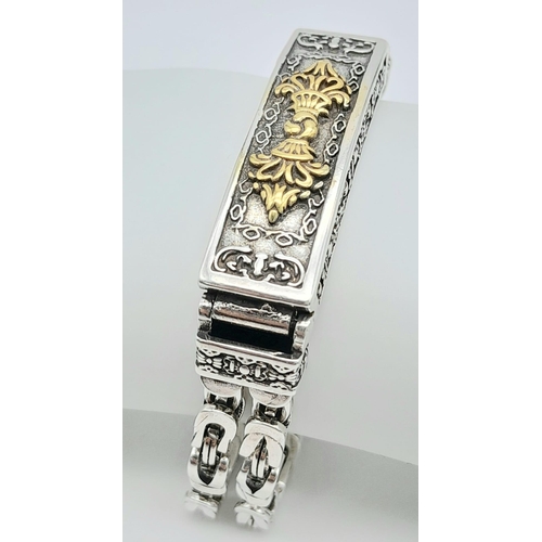 33 - A Tibetan silver double chained bracelet of Buddhist interest, with the “Vajra” symbol. Length: 21 c... 