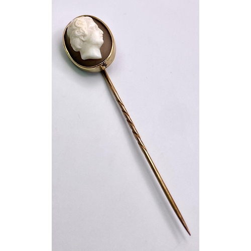 351 - An Antique Mid-Carat Gold Cameo Mourning Stick-Pin. 7.5cm.
4.67g total weight. Comes with original c... 