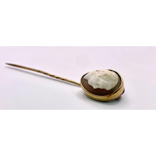 351 - An Antique Mid-Carat Gold Cameo Mourning Stick-Pin. 7.5cm.
4.67g total weight. Comes with original c... 