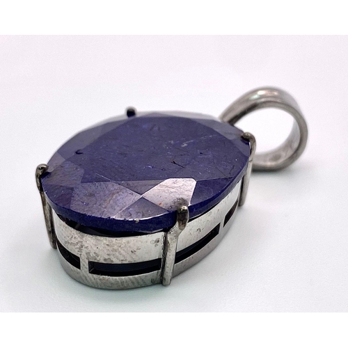 357 - An African Blue Sapphire Pendant set in 925 Sterling silver. 26.80ct. 8.88g total weight. Comes with... 