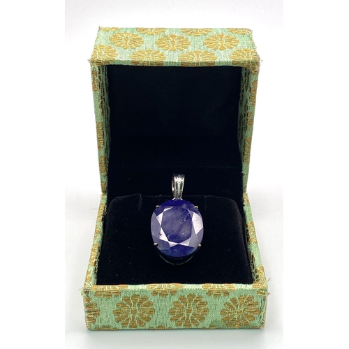 357 - An African Blue Sapphire Pendant set in 925 Sterling silver. 26.80ct. 8.88g total weight. Comes with... 