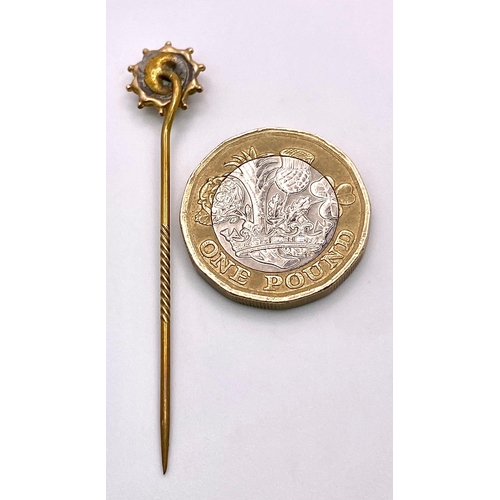 367 - An Antique Mid-Karat Gold, Seed Pearl and Ruby Stick-Pin. 5.5cm. 0.91g total weight.