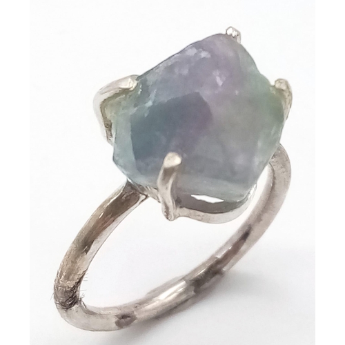 378 - A Rough Apatite Ring set in 925 Sterling silver. Size O. 4.42g total weight. Comes with a presentati... 