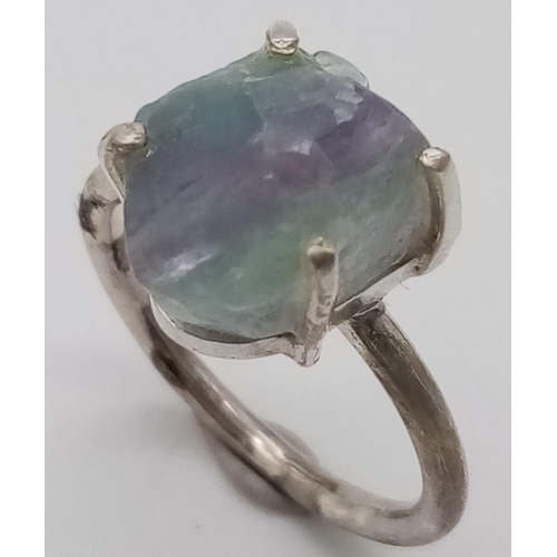 378 - A Rough Apatite Ring set in 925 Sterling silver. Size O. 4.42g total weight. Comes with a presentati... 