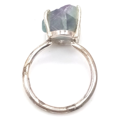 378 - A Rough Apatite Ring set in 925 Sterling silver. Size O. 4.42g total weight. Comes with a presentati... 