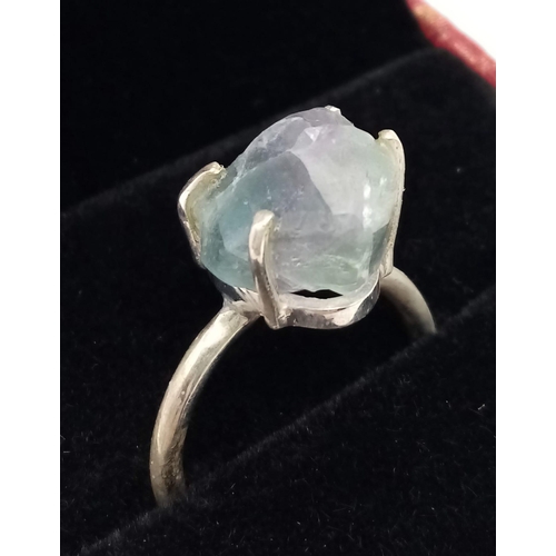 378 - A Rough Apatite Ring set in 925 Sterling silver. Size O. 4.42g total weight. Comes with a presentati... 