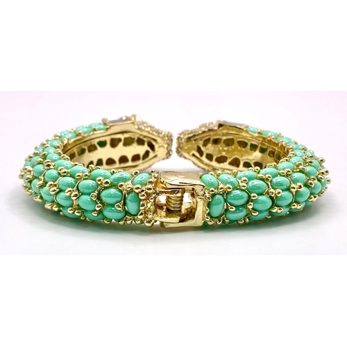 40 - An absolutely fabulous turquoise coloured bangle with cubic zirconia studded two panther heads, ador... 