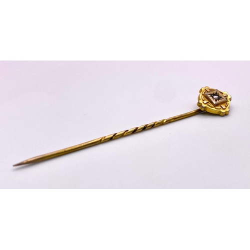 424 - An Antique Mid-Karat Gold and Diamond Stick-Pin. 6.5cm. Comes with its original French case. 1.52g t... 