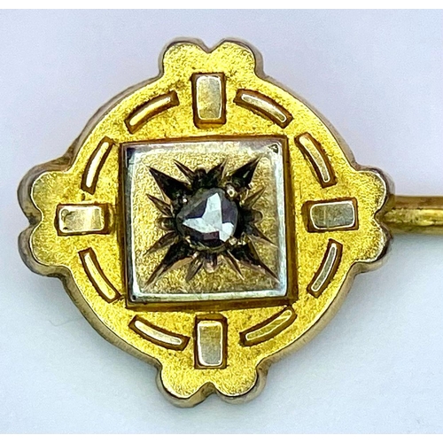 424 - An Antique Mid-Karat Gold and Diamond Stick-Pin. 6.5cm. Comes with its original French case. 1.52g t... 