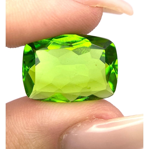 47 - A beautiful pair of large (16 carats each), emerald cut, PERIDOTS, with excellent colour uniformity ... 