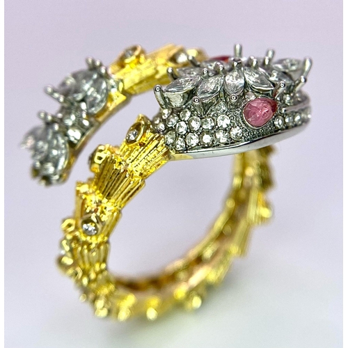 96 - The perfect present for a loved one: A very attractive, gold-plated snake ring loaded with Cubic zir... 