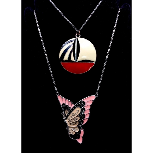 1129 - A pair of Colourful Enamel Necklaces.
A pretty Butterfly (6cm) pendant on a 46cm Necklace and a intr... 