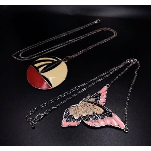 1129 - A pair of Colourful Enamel Necklaces.
A pretty Butterfly (6cm) pendant on a 46cm Necklace and a intr... 