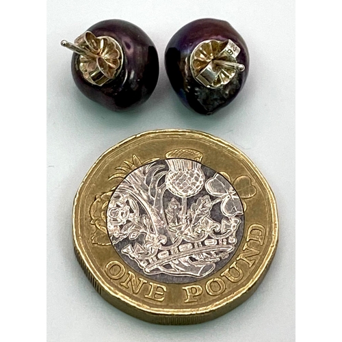 849 - A Pair of Cultured Black Pearl Stud Earrings.