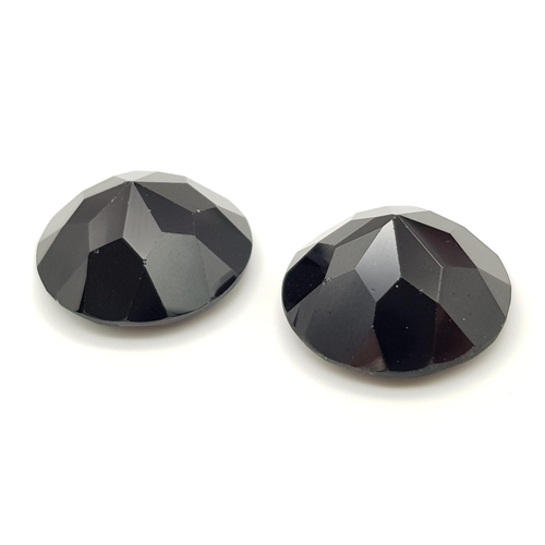 1114 - A Pair of 67.32ct Round Brilliant Shaped Dark Red Garnets. 20mm. AIG Milan Certified.