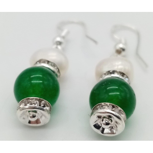 856 - A Pair of Jade and Cultured Pearl Earrings.