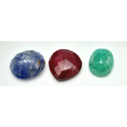 850 - A Lot of 3 Gemstones, Mixed Shape Faceted Ruby, Emerald and Blue Sapphire. Total 43.70ct.