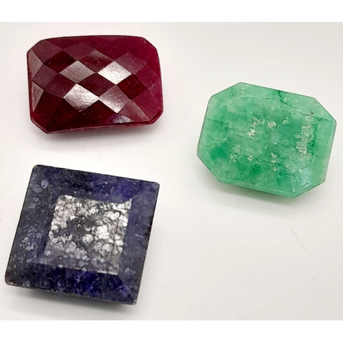 827 - A lot of 35.40CT Gemstones. A Faceted Ruby, Emerald & Blue Sapphire. Mixed Shapes.