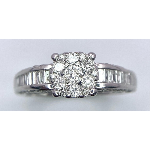 11 - A 18K WHITE GOLD DIAMOND CLUSTER RING, WITH COMBINATION OF ROUND BRILIANTS & BAGUETTE CUTS DIAMONDS ... 