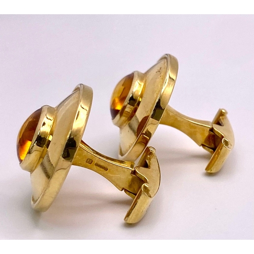 148 - A Designer Pair of Theo Fennell 18K Yellow Gold and Citrine Cufflinks. Cognac coloured rich oval cut... 