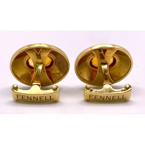 148 - A Designer Pair of Theo Fennell 18K Yellow Gold and Citrine Cufflinks. Cognac coloured rich oval cut... 