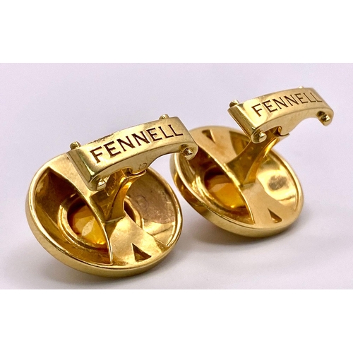 148 - A Designer Pair of Theo Fennell 18K Yellow Gold and Citrine Cufflinks. Cognac coloured rich oval cut... 