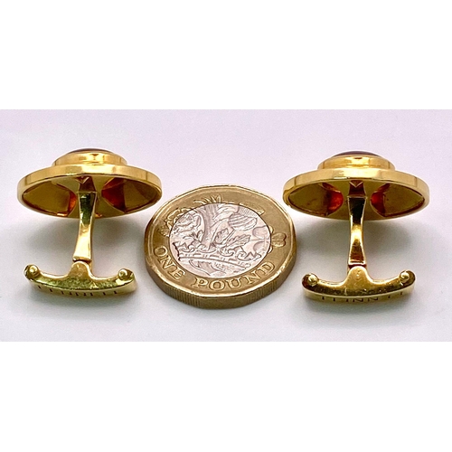 148 - A Designer Pair of Theo Fennell 18K Yellow Gold and Citrine Cufflinks. Cognac coloured rich oval cut... 