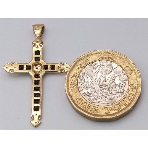 228 - A 9K YELLOW GOLD DIAMOND & SAPPHIRE CROSS PENDANT. TOTAL WEIGHT 1.1G ( 2 SMALL DIAMONDS MISSING HARD... 